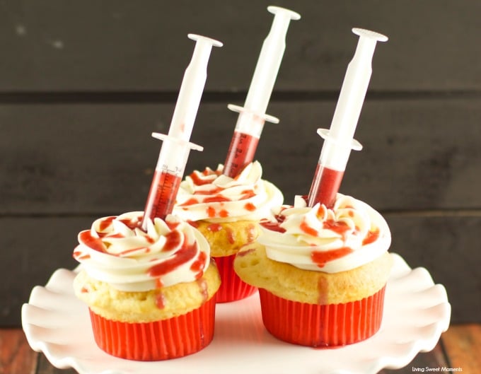 Bloody Cupcakes - the perfect Halloween Treat for a party! Vanilla cupcakes with vanilla buttercream filled with strawberry coulis. Decadent and original!