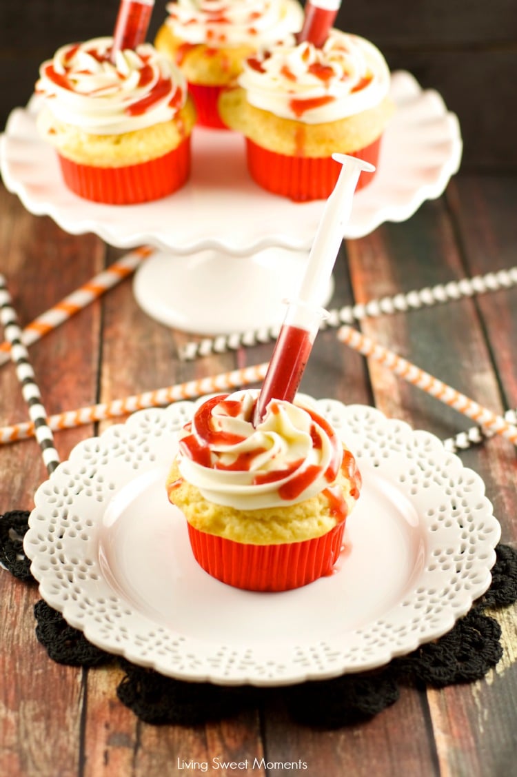 Bloody Cupcakes - the perfect Halloween Treat for a party! Vanilla cupcakes with vanilla buttercream filled with strawberry coulis. Decadent and original!