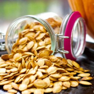 Roasted Pumpkin Seeds - don't know what to do with the seeds after you carve that pumpkin? Create a a healthy crunchy snack with the seeds. Easy and delish!