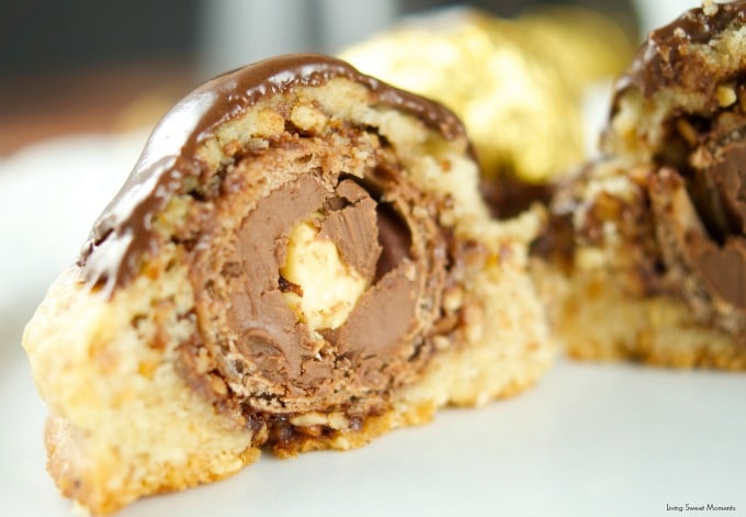 This Ferrero stuffed hazelnut cookies are topped with melted chocolate. The perfect crispy cookie recipe that will wow a crowd. Best dessert ever! Yum