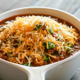 This delicious Slow Cooker Chili Recipe is easy to make, hearty and it definitely feeds a crowd. The perfect winter recipe! Just add your favorite toppings.