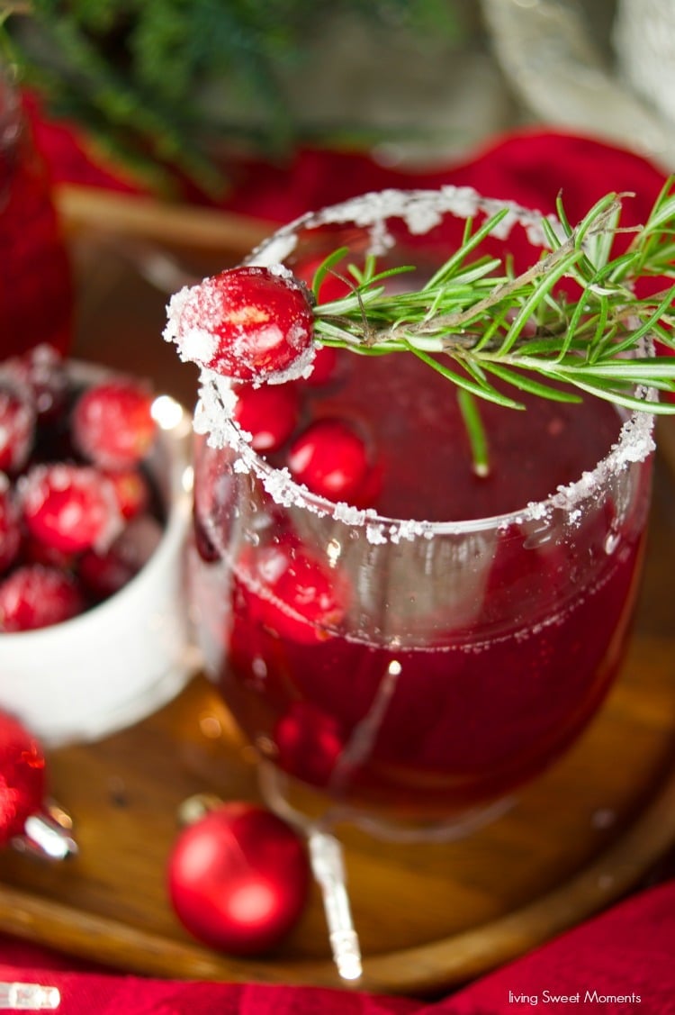 This delicious Holiday Cranberry Mocktail is infused with rosemary and cranberry syrup. Topped with a fizzy lime soda! The perfect drink for Holiday parties