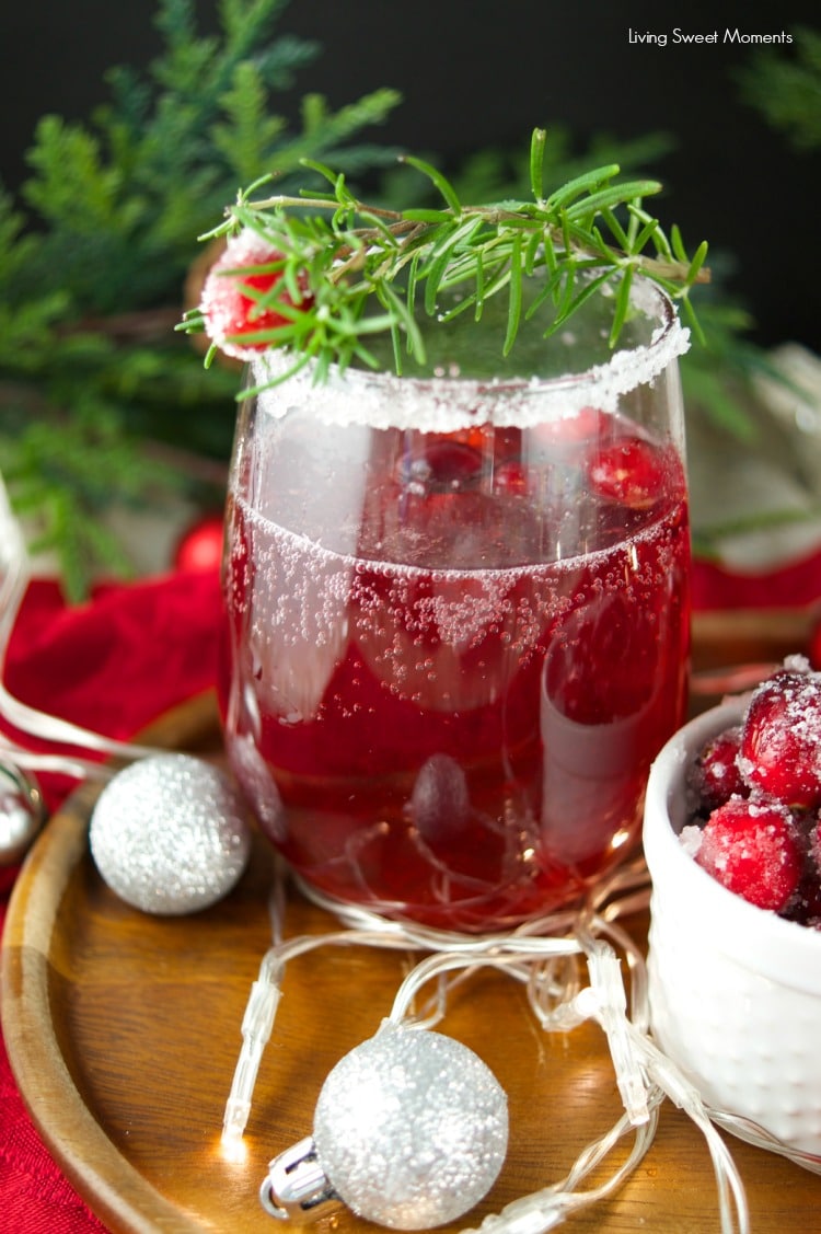 This delicious Holiday Cranberry Mocktail is infused with rosemary and cranberry syrup. Topped with a fizzy lime soda! The perfect drink for Holiday parties