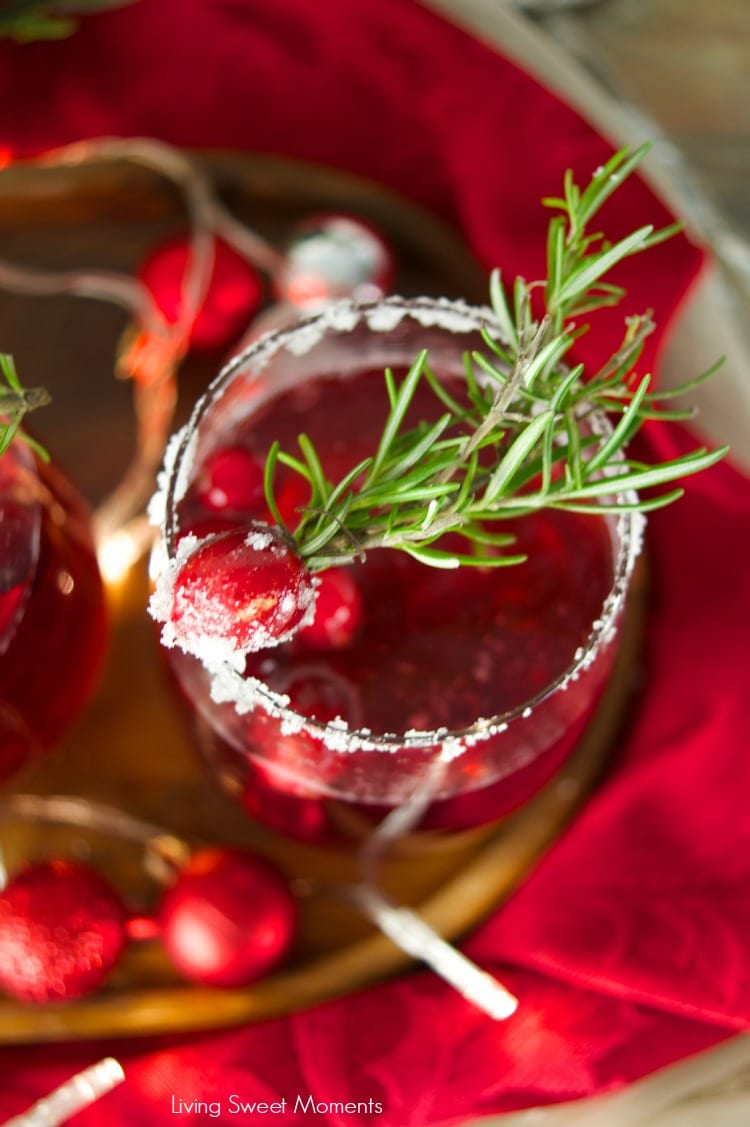 This delicious Holiday Cranberry Mocktail is infused with rosemary and cranberry syrup. Topped with a fizzy lime soda! The perfect drink for Holiday parties