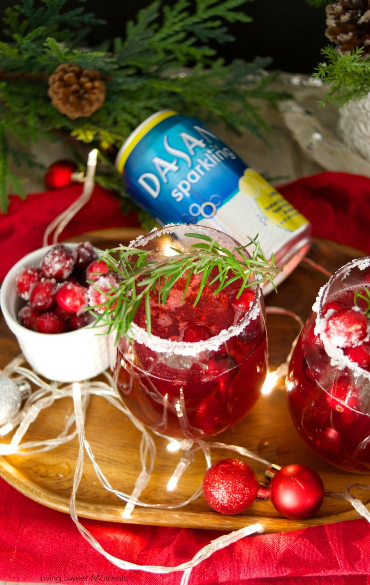 This delicious Holiday Cranberry Mocktail is infused with rosemary and cranberry syrup. Topped with a fizzy lime soda! The perfect drink for Holiday parties