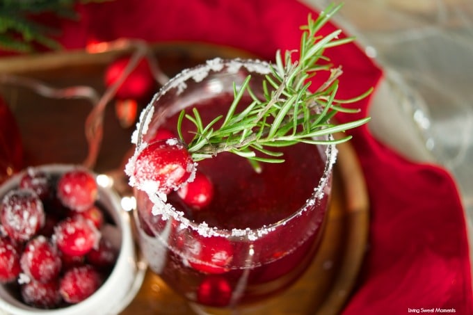 This delicious Holiday Cranberry Mocktail is infused with rosemary and cranberry syrup. Topped with a fizzy lime soda! The perfect drink for Holiday parties