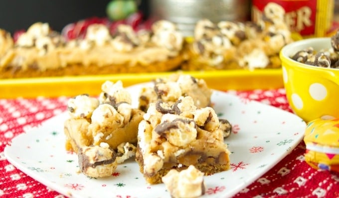 These delicious popcorn bars has a chewy peanut butter cookie crust and is topped with salted caramel fudge popcorn. The perfect dessert for kids & parties