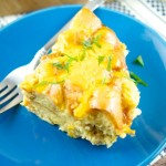 This delicious Slow-Cooker Cheesy Bacon Strata is easy to make and delicious for breakfast, brunch and even dinner. Perfect for any party or gathering. Yum!