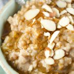 This delicious Slow Cooker Apple Oatmeal cooks overnight. It's vegan, healthy and full of flavor. Wake up to a hot bowl of apple pie oatmeal full of spice.