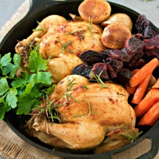 Delicious and juicy oven roasted cornish hens recipe with baked Veggies. The perfect fancy dinner idea to serve on Easter or any other Holiday. My favorite!