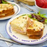 These Croque Monsieur Baked sandwiches are filled ham and cheese and topped with bechamel sauce and gruyere cheese. An easy recipe for dinner or brunch.