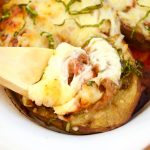 This delicious Cheesy Stuffed Eggplant Recipe is easy to make, vegetarian and very cheesy. The eggplant is roasted for extra flavor. Perfect as a side dish.