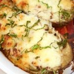 This delicious Cheesy Stuffed Eggplant Recipe is easy to make, vegetarian and very cheesy. The eggplant is roasted for extra flavor. Perfect as a side dish.