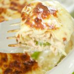 This easy & delicious Salmon Lasagna Recipe is made with flaky salmon and asparagus. Then is baked in a dilly Bechamel sauce. Perfect for weeknight dinner.