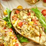 This delicious Tomato Stuffed Roasted Eggplant is super easy to make and the perfect vegetarian entree that is filling and tasty. Great for parties as well!