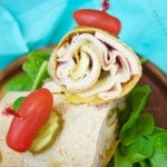 This delicious Cuban Sandwich Wrap made with turkey, is ready in 5 minutes or less and is the perfect quick weeknight dinner that is both exotic and tasty!