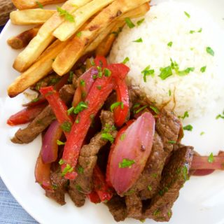 This delicious beef stir fry recipe (Peruvian Lomo Saltado) is made in 15 minutes or less and is healthy, tasty and perfect for a quick weeknight dinner.
