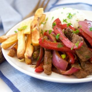 This delicious beef stir fry recipe (Peruvian Lomo Saltado) is made in 15 minutes or less and is healthy, tasty and perfect for a quick weeknight dinner.