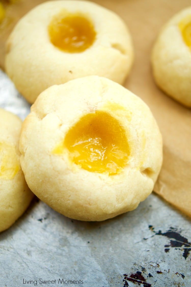 This delicious thumbprint cookie recipe is made with homemade passion fruit curd in a shortbread cookie dough. Perfect for dessert and tea. Yummy!
