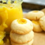 This delicious thumbprint cookie recipe is made with homemade passion fruit curd in a shortbread cookie dough. Perfect for dessert and tea. Yummy!