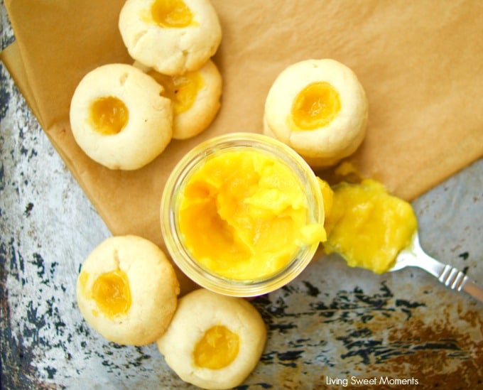 This delicious thumbprint cookie recipe is made with homemade passion fruit curd in a shortbread cookie dough. Perfect for dessert and tea. Yummy!