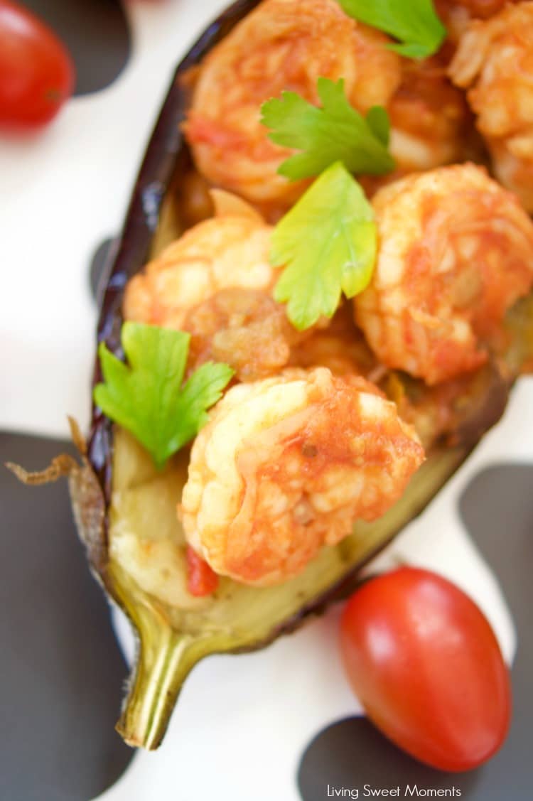 This delicious Shrimp Stuffed Eggplant Recipe is easy to make and is perfect for a nice weeknight dinner idea. The filling is inspired by Italian Caponata