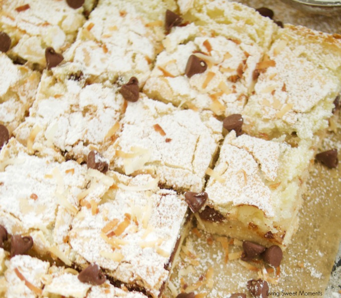 This delicious St. Louis Gooey Butter Cake Recipe is easy to make and has chocolate and coconut in the middle for extra flavor. The perfect summer dessert! 