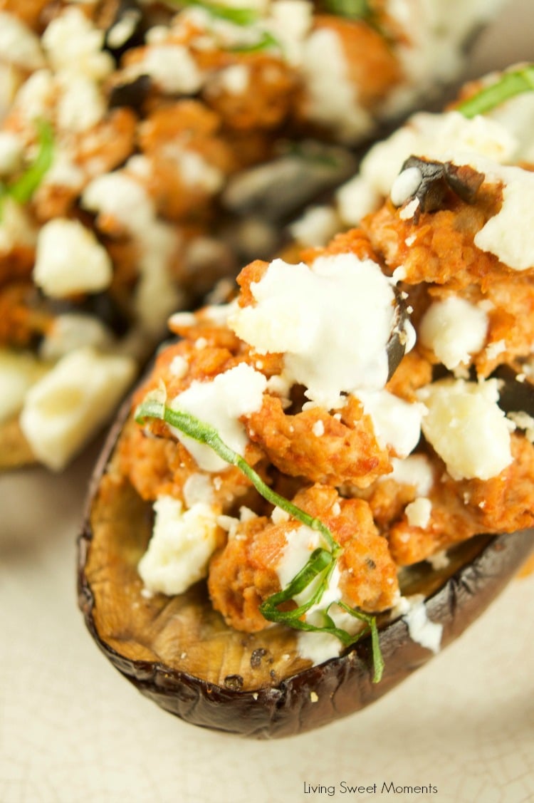 This tasty Greek Stuffed Eggplant is made with meat, kalamata olives and topped with feta cheese and tzatziki sauce. The perfect quick weeknight dinner idea