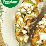 This tasty Greek Stuffed Eggplant is made with meat, kalamata olives and topped with feta cheese and tzatziki sauce. The perfect quick weeknight dinner idea