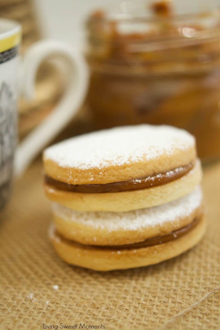 Alfajores Recipe - they are delicate shortbread cookies filled with dulce de leche. These cookies use cornstarch as a main ingredient. Great with coffee!