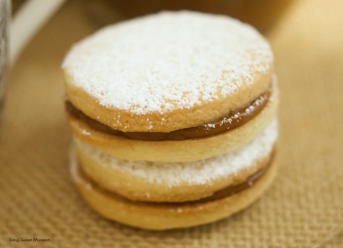 Alfajores Recipe - they are delicate shortbread cookies filled with dulce de leche. These cookies use cornstarch as a main ingredient. Great with coffee!