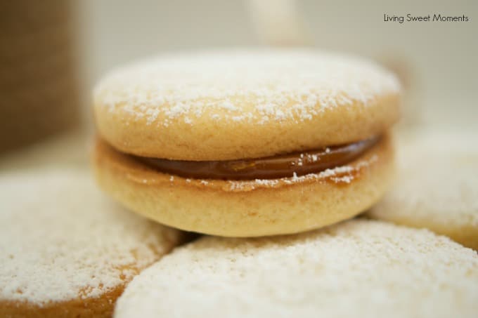 Alfajores Recipe - they are delicate shortbread cookies filled with dulce de leche. These cookies use cornstarch as a main ingredient. Great with coffee!