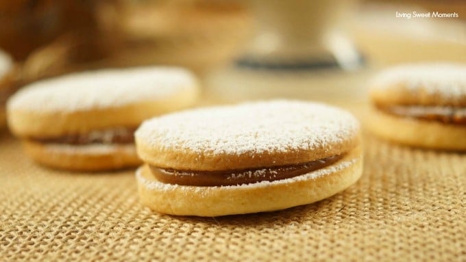 Alfajores Recipe - they are delicate shortbread cookies filled with dulce de leche. These cookies use cornstarch as a main ingredient. Great with coffee!