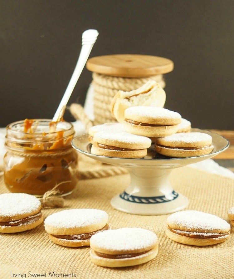 Alfajores Recipe - they are delicate shortbread cookies filled with dulce de leche. These cookies use cornstarch as a main ingredient. Great with coffee!