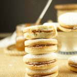 Alfajores Recipe - they are delicate shortbread cookies filled with dulce de leche. These cookies use cornstarch as a main ingredient. Great with coffee!