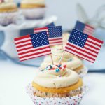 Peanut Butter And Jelly Cupcakes - delicious vanilla cupcakes filled with jelly and topped with peanut butter. The perfect dessert for any occasion.