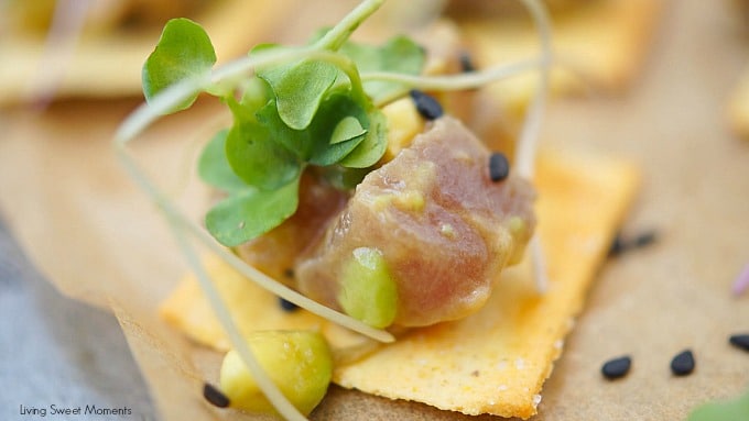 This delicious tuna tartare recipe is made with avocado and dressed in an Asian sauce. The perfect healthy appetizer served on top of a cracker. 