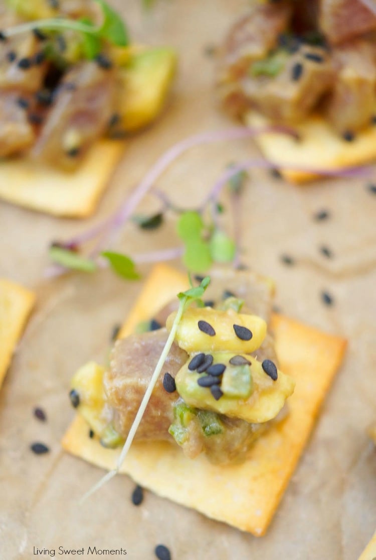 This delicious tuna tartare recipe is made with avocado and dressed in an Asian sauce. The perfect healthy appetizer served on top of a cracker. 