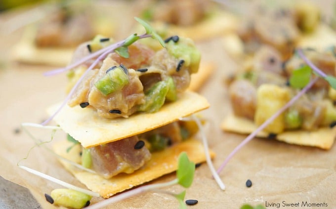 This delicious tuna tartare recipe is made with avocado and dressed in an Asian sauce. The perfect healthy appetizer served on top of a cracker. 