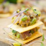 This delicious tuna tartare recipe is made with avocado and dressed in an Asian sauce. The perfect healthy appetizer served on top of a cracker.