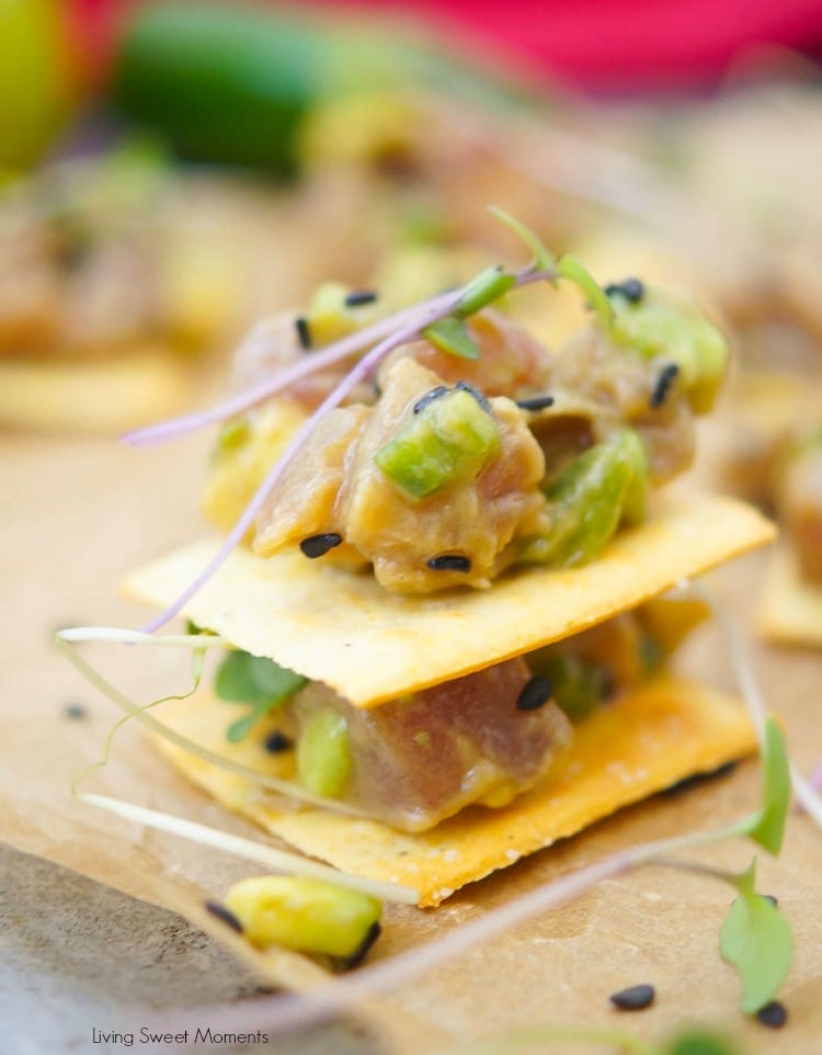 This delicious tuna tartare recipe is made with avocado and dressed in an Asian sauce. The perfect healthy appetizer served on top of a cracker. 