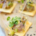 This delicious tuna tartare recipe is made with avocado and dressed in an Asian sauce. The perfect healthy appetizer served on top of a cracker.