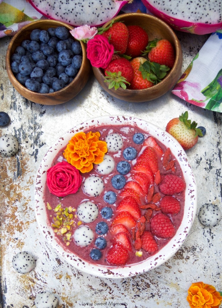 This delicious acai bowl recipe is blended with berries, dragonfruit, and yogurt. It's topped with fresh fruit and nuts. A healthy and quick breakfast idea.