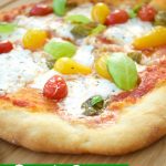 This delicious burrata pizza recipe is made with homemade pizza dough and is topped with sauce, summer tomatoes, and burrata cheese. Great for entertaining!