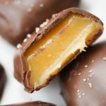 This chocolate covered Apple Cider Caramels recipe is easy to make. The perfect fancy dessert for fall. Made with reduced apple cider for a deeper taste.