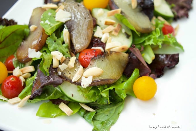 This tasty maple Roasted Peach Salad recipe is served with greens, tomatoes, almonds, parmesan and almonds, then tossed with a tangy maple vinaigrette.