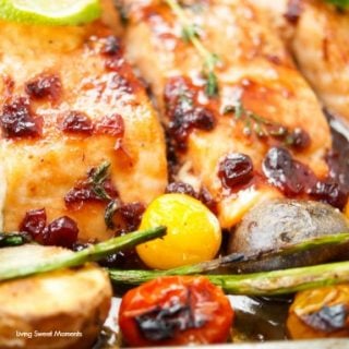 This delicious & easy Salmon Sheet Pan Dinner recipe is made in 30 minutes or less and has a sweet tangy sauce. Served with potatoes, asparagus, & tomatoes.