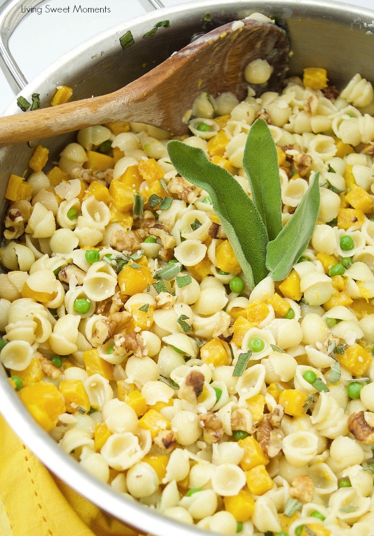 This creamy Mac And Cheese recipe is inspired by fall featuring butternut squash, peas, sage, and walnuts. The perfect easy 30-minute weeknight dinner idea. Vegetarian too! 
