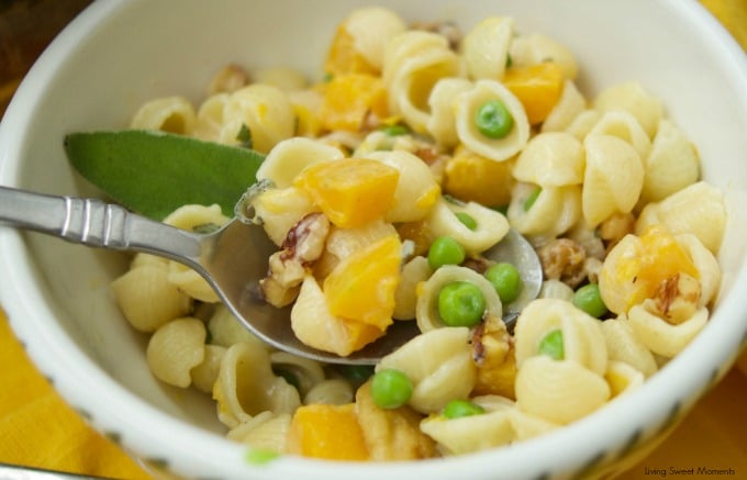 This creamy Mac And Cheese recipe is inspired by fall featuring butternut squash, peas, sage, and walnuts. The perfect easy 30-minute weeknight dinner idea. Vegetarian too!