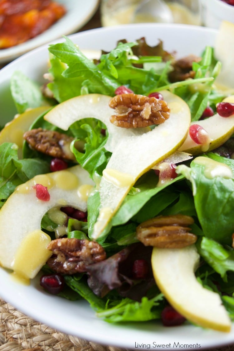 This tasty pomegranate Pear Salad is served with candied pecans and drizzled with a mustard dressing. The perfect autumn quick salad to serve with dinner.